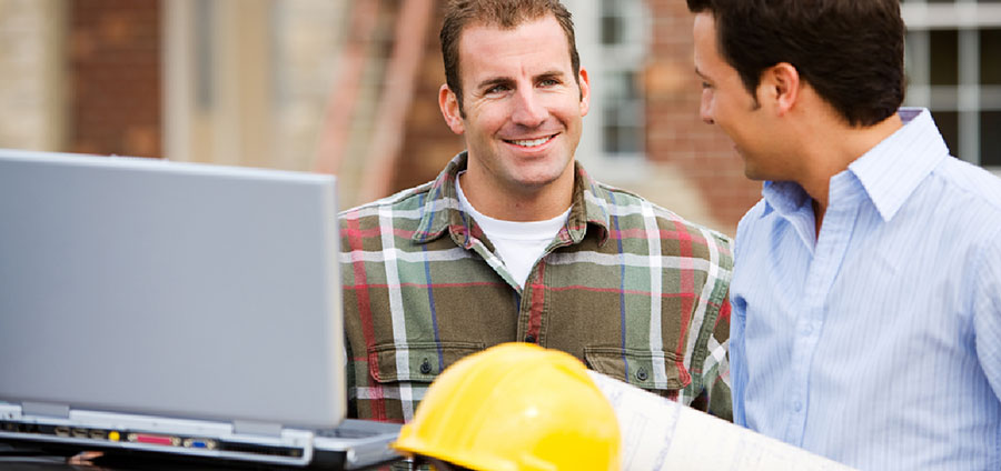 two people with laptop