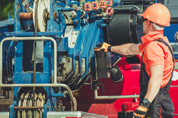 construction worker operating machinery on a job